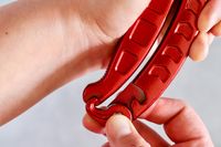 Hands showing the lever-style locking mechanism for the Dragon Riot poultry shears