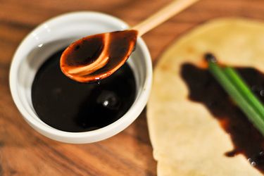 A ramekin of homemade hoisin sauce. A hoisin-smeared Mandarin pancake is visible off to the side.