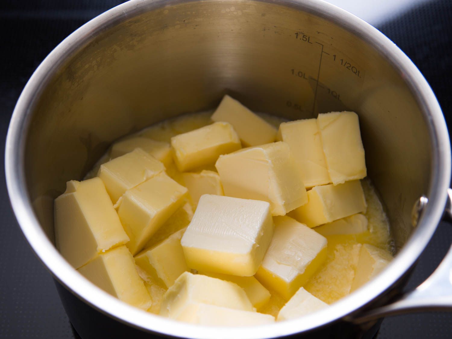 Chunks of butter melting in a pot