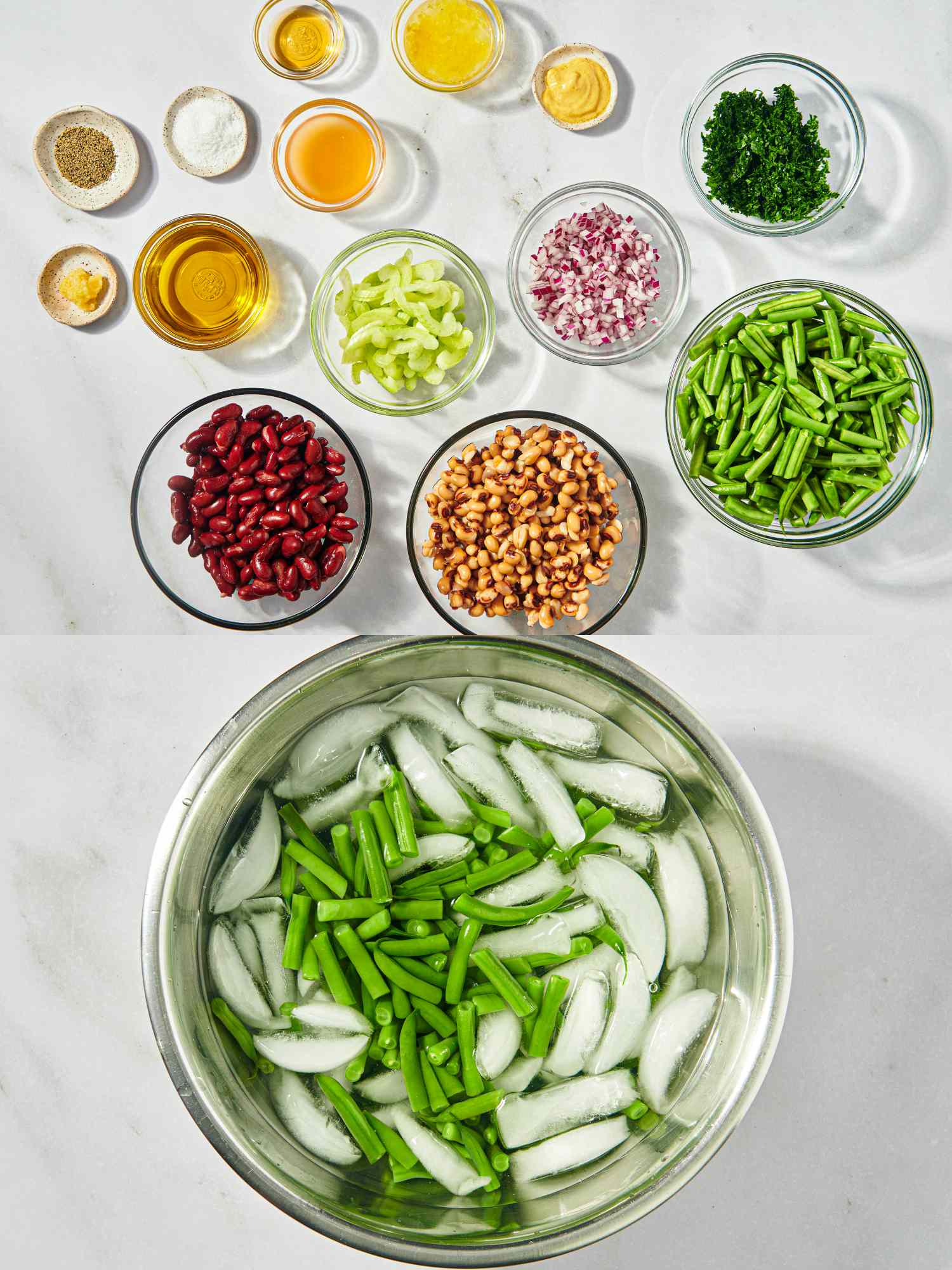 Ingredients for a bean salad with green beans in an ice bath and bowls of beans and diced vegetables arranged on a countertop