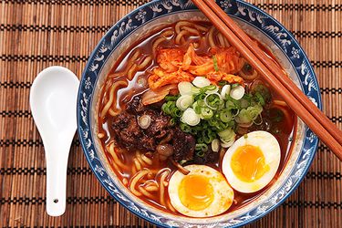 A bowl of homemade shin cup-style spicy Korean ramyum beef noodle soup.