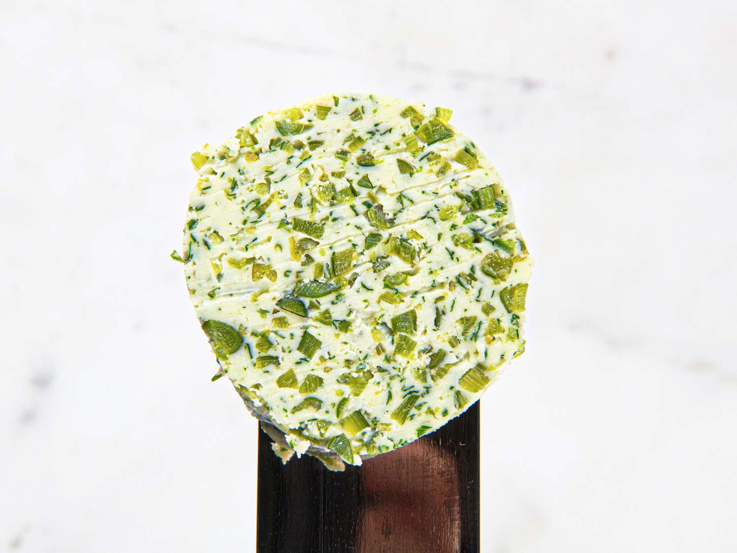 close-up of garlic scape butter