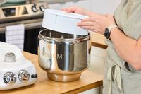 Tester fiddling with Ankarsrum Stand Mixer mixing bowl