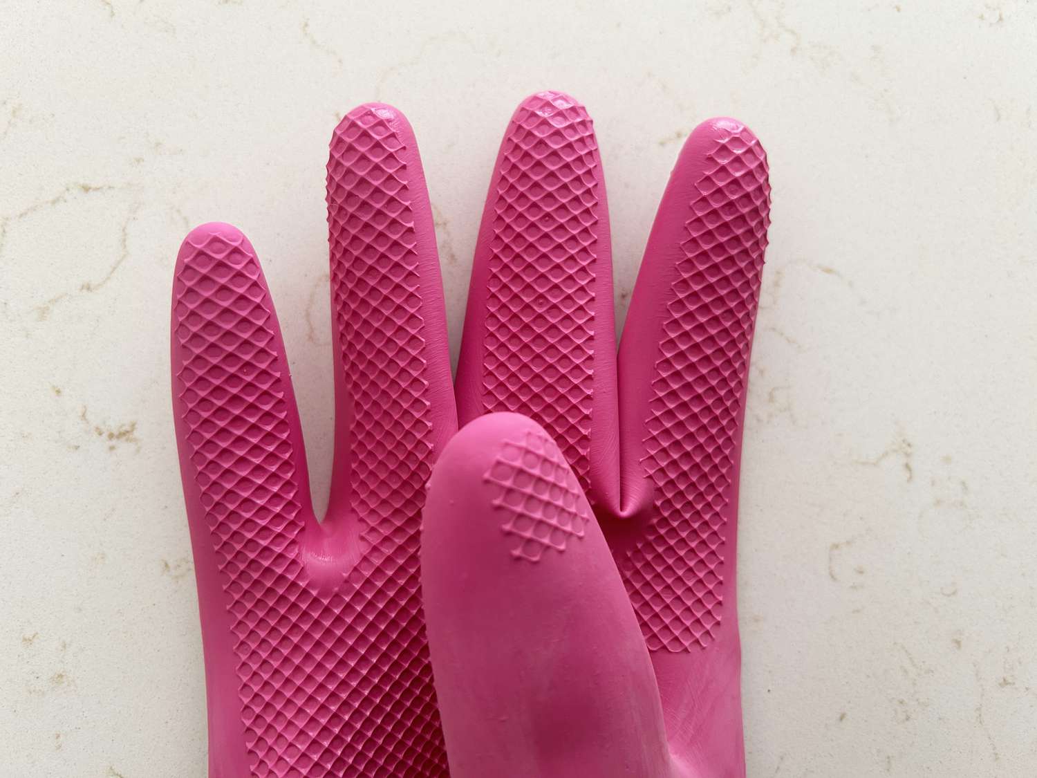 A closeup of a textured dish glove