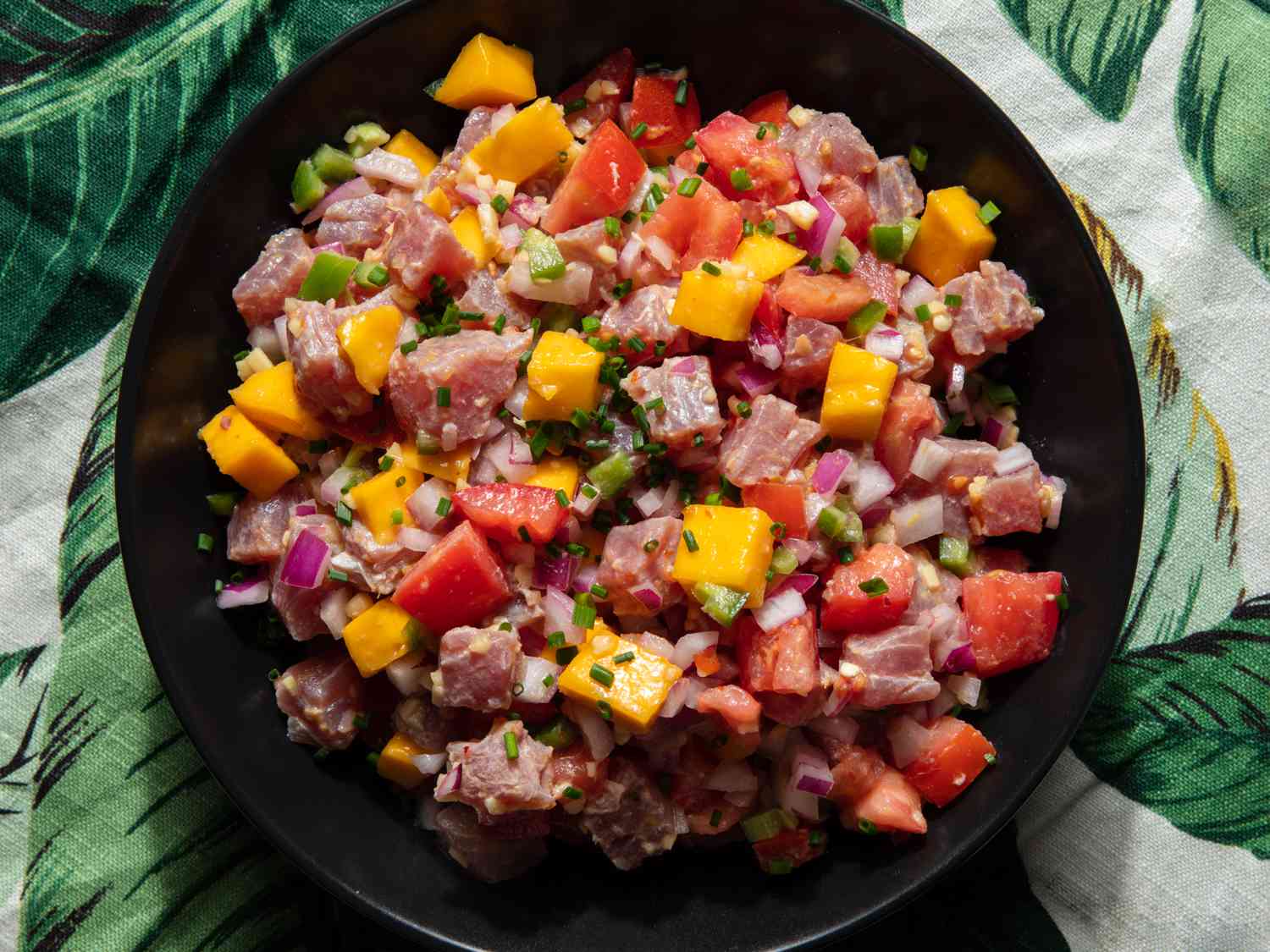 Kinilaw (Filipino tuna ceviche) on a plate with a tropical print 