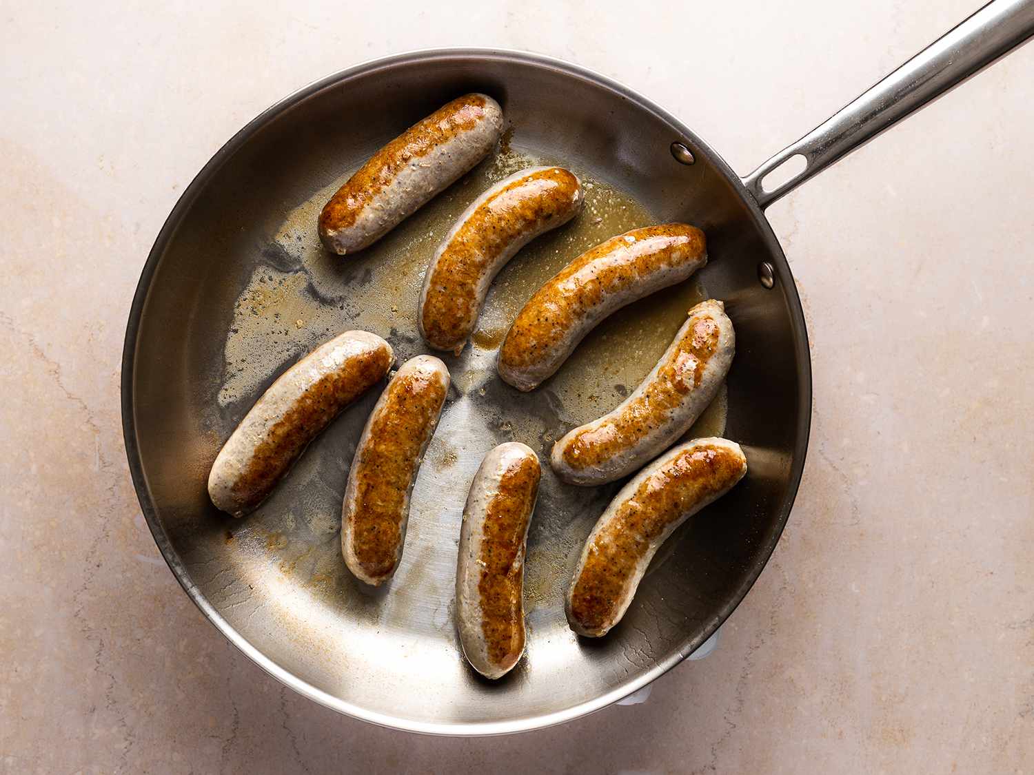 Sausage cooking in a pan