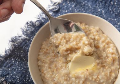 Bowl of instant pot oatmeal in a bowl with blue textile 