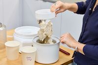 A person removing the churner from ice cream in the Cuisinart 1.5-Quart Ice Cream Maker