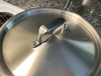 A closeup of the handled lid of the Misen 2-Quart Saucier