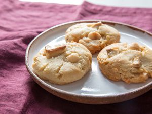 Trio of white chocolate macadamia nut cookies plated