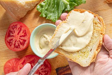 Overhead view of caesar mayo on a piece of bread