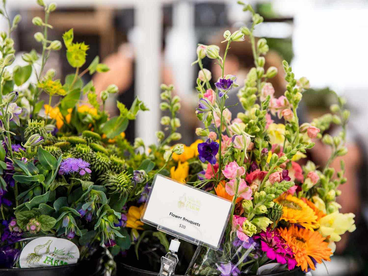 Flower bouquets for sale at the Willow Wisp Organic Farm farmers market stand