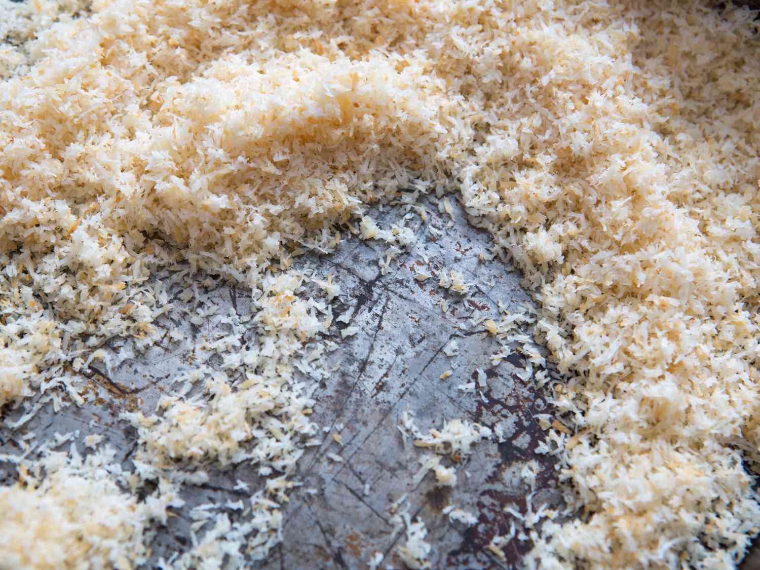 Toasted coconut in a pan.