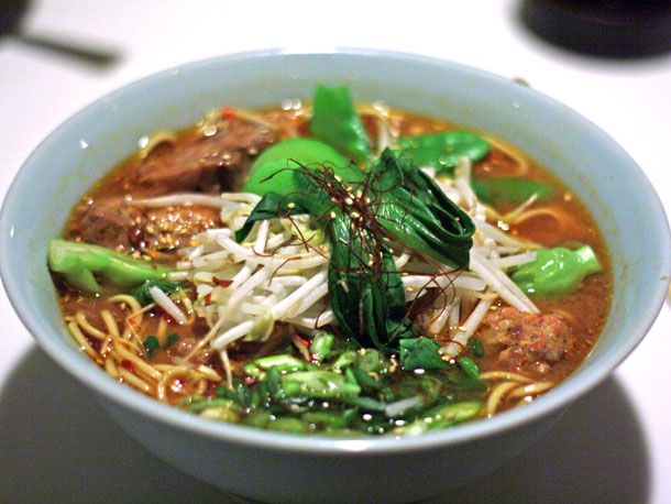 Tantanmen resting in a light blue bowl.