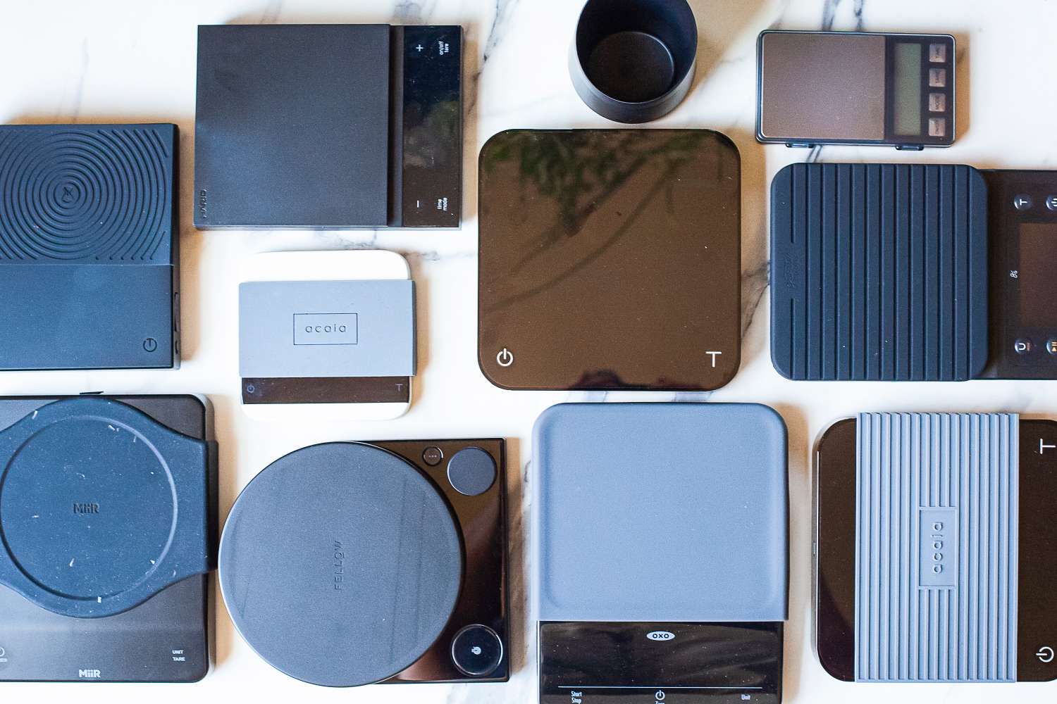 Various coffee related scales arranged on a surface