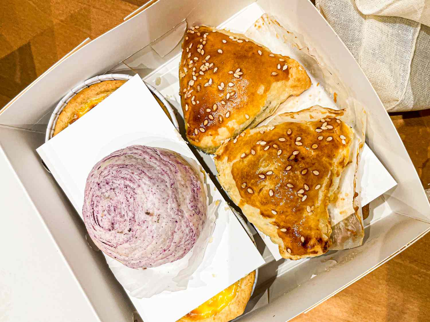 Takeout box of desserts from Happy Bakery