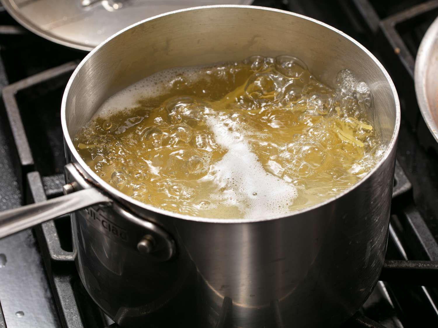 Spaghetti boiling in a saucepan.