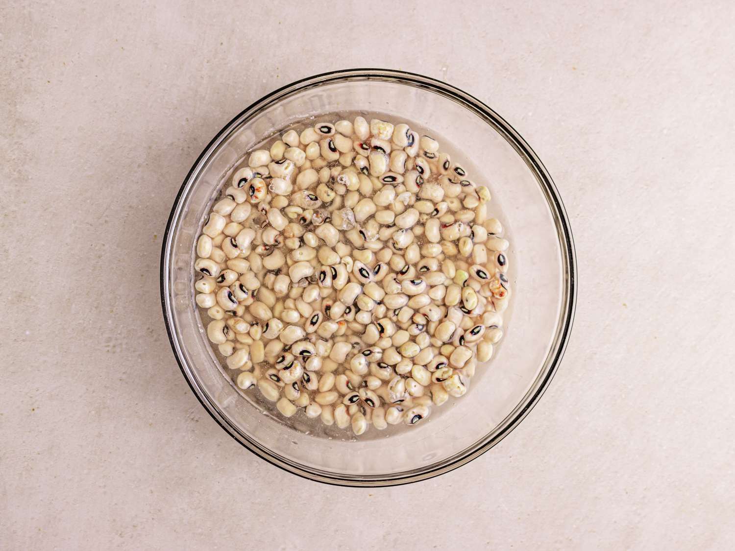 Overhead view of blacked peas in water