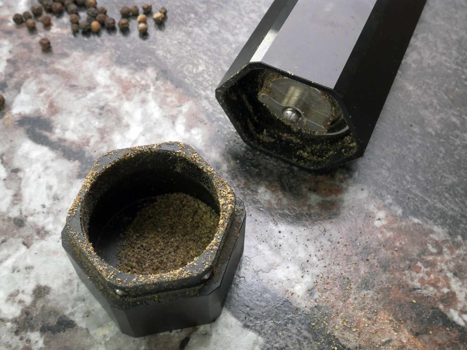 a closeup of the HexMill catch basin and grind adjuster on the bottom of the mill