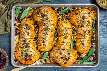 Overhead of hasselback butternut squash on a baking sheet