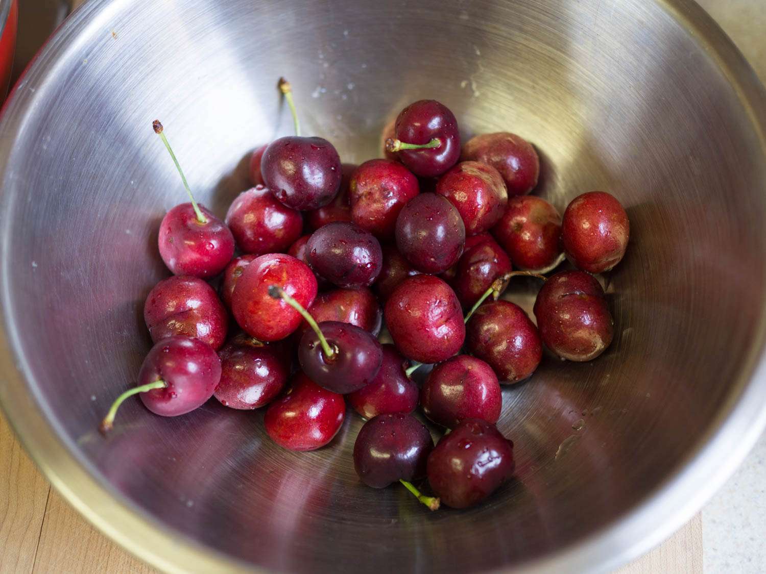 A bowl of whole cherries.