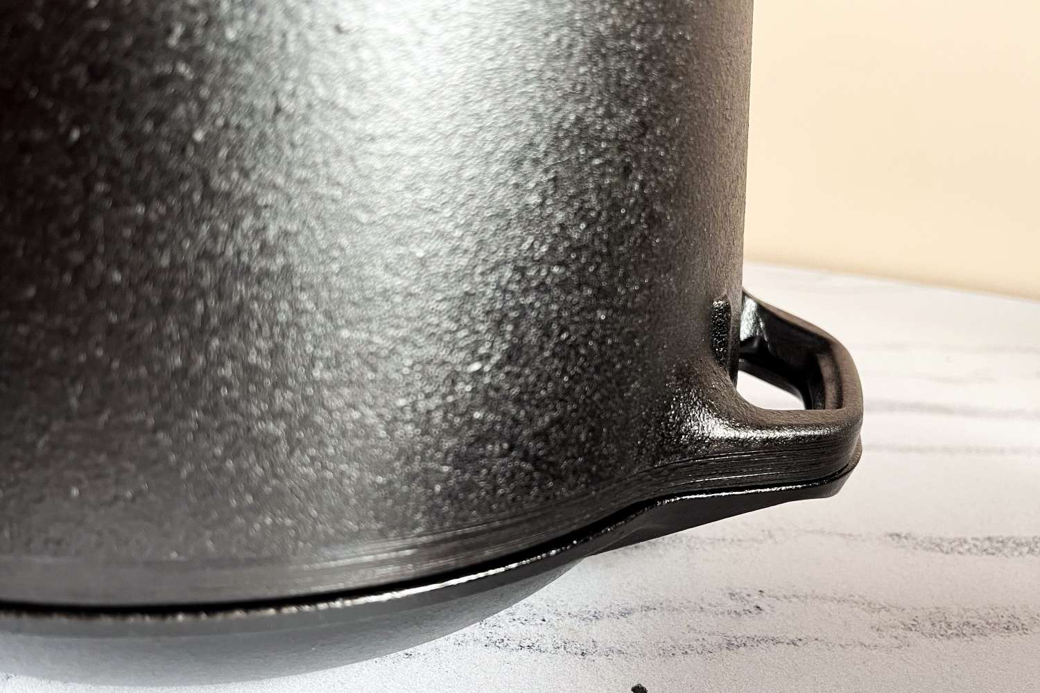 Closeup of a cast iron double dutch oven handle