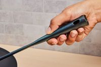 a closeup of the handle on a wok chuan