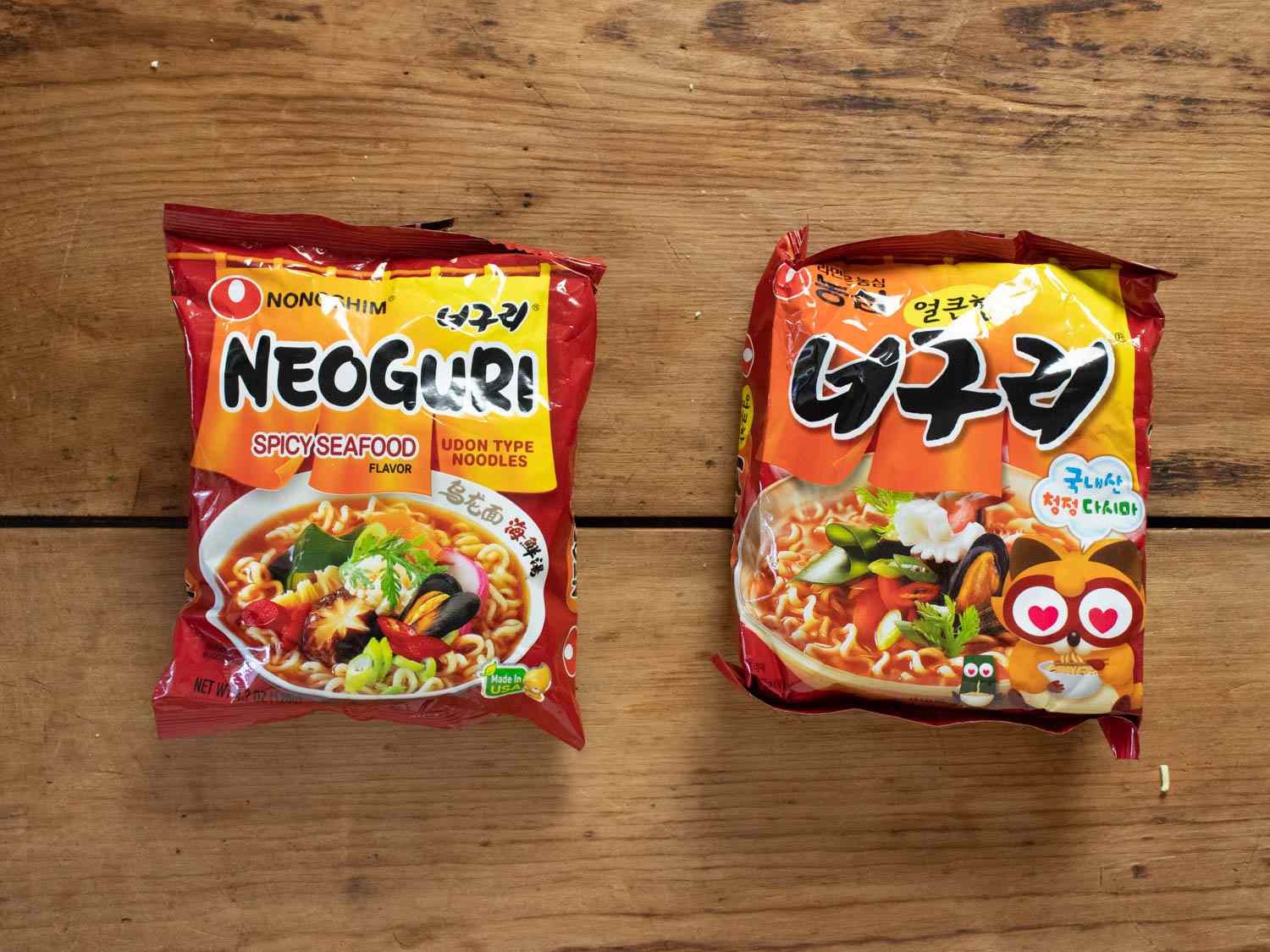 Neoguri Seafood Noodle soups in packaging side by side, with Korean version on the right.
