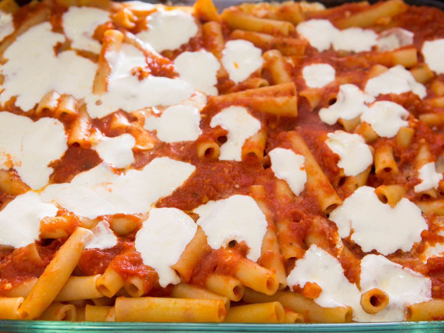 Melted mozzarella on baked ziti.