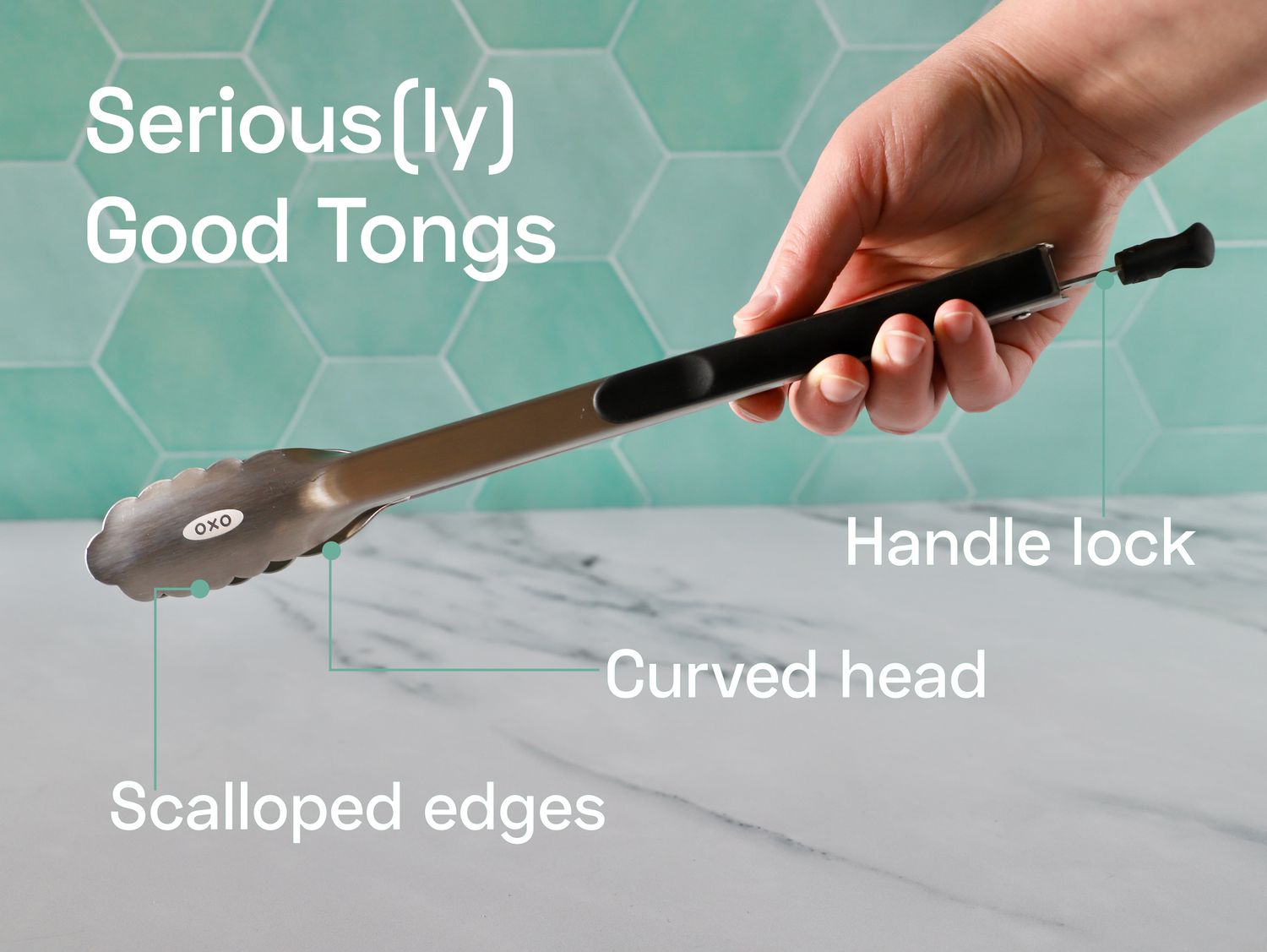 Hand holding the OXO Good Grips 12-Inch Tongs