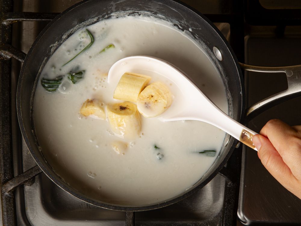 Adding bananas to the mixture