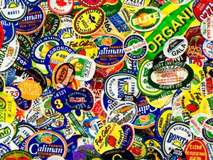 A variety of fruit stickers clustered together