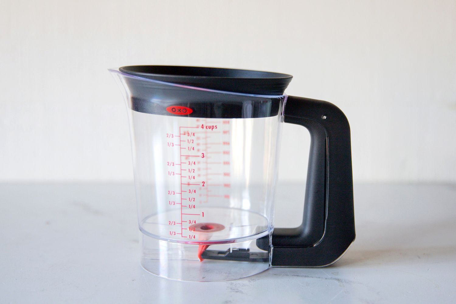 Transparent measuring cup with a handle capable of measuring up to 4 cups