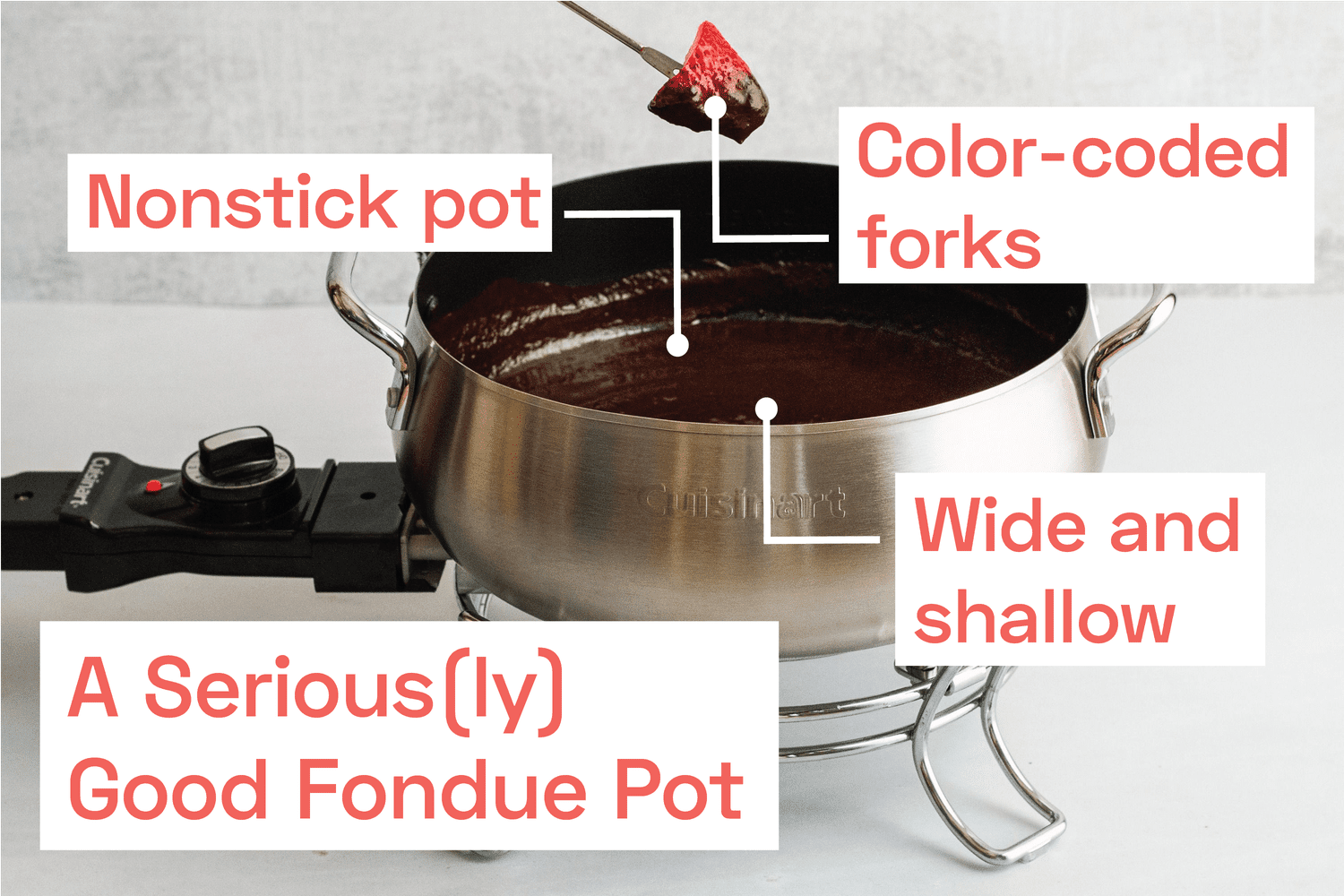  A strawberry being dipped into chocolate fondue.