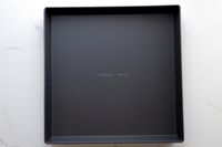 An empty LloydPans 12x12x1.5 inch Sicilian Style Pizza Pan