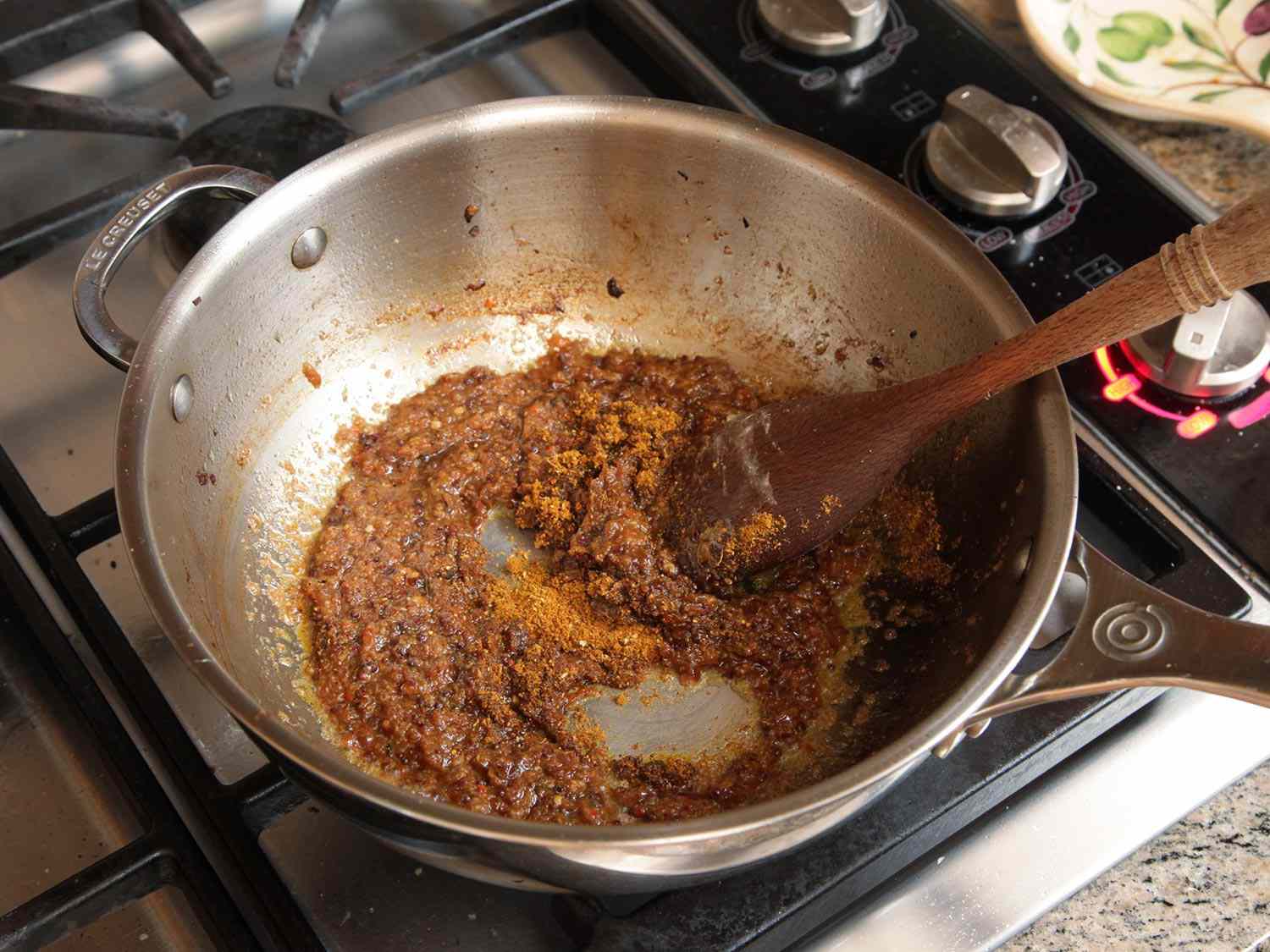 Garam masala is stirred into the caramelized onion-garlic-ginger mixture.