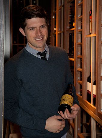 Wine Expert holding a bottle of wine