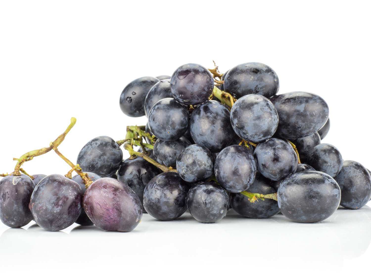 A bunch of grapes on a white background