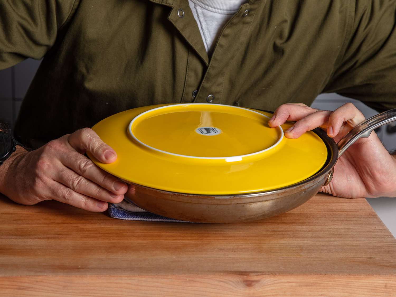 Flipping the potato cake on the plate into a skillet.