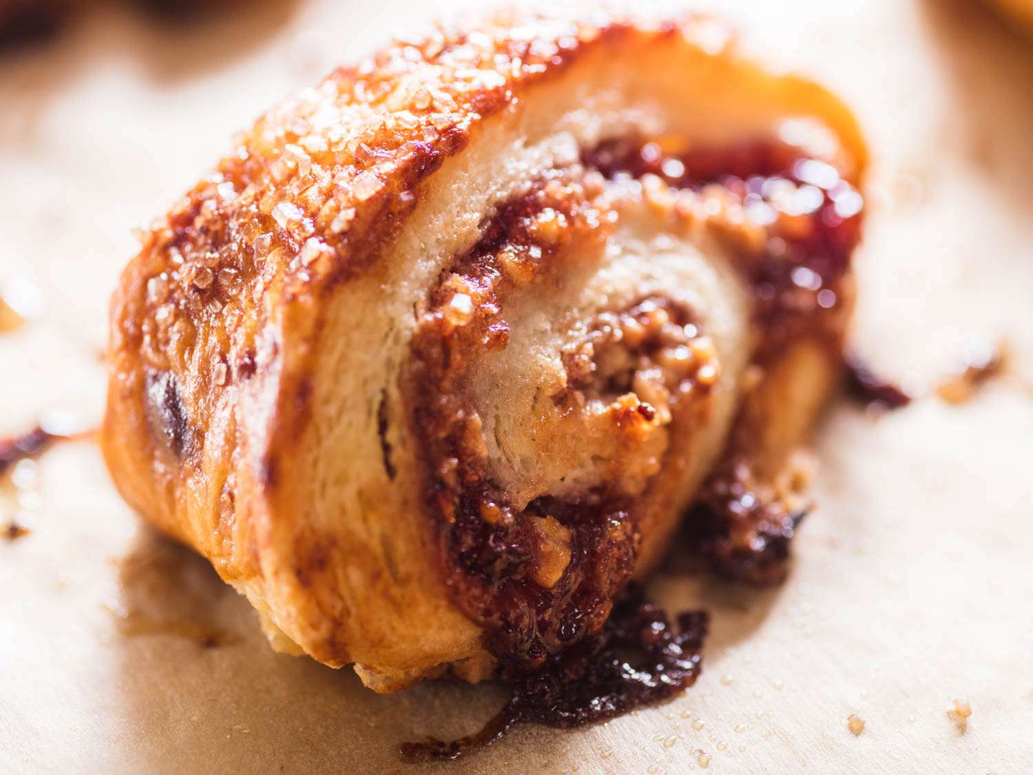 Close-up of a spiral-sliced raspberry-almond rugelach.
