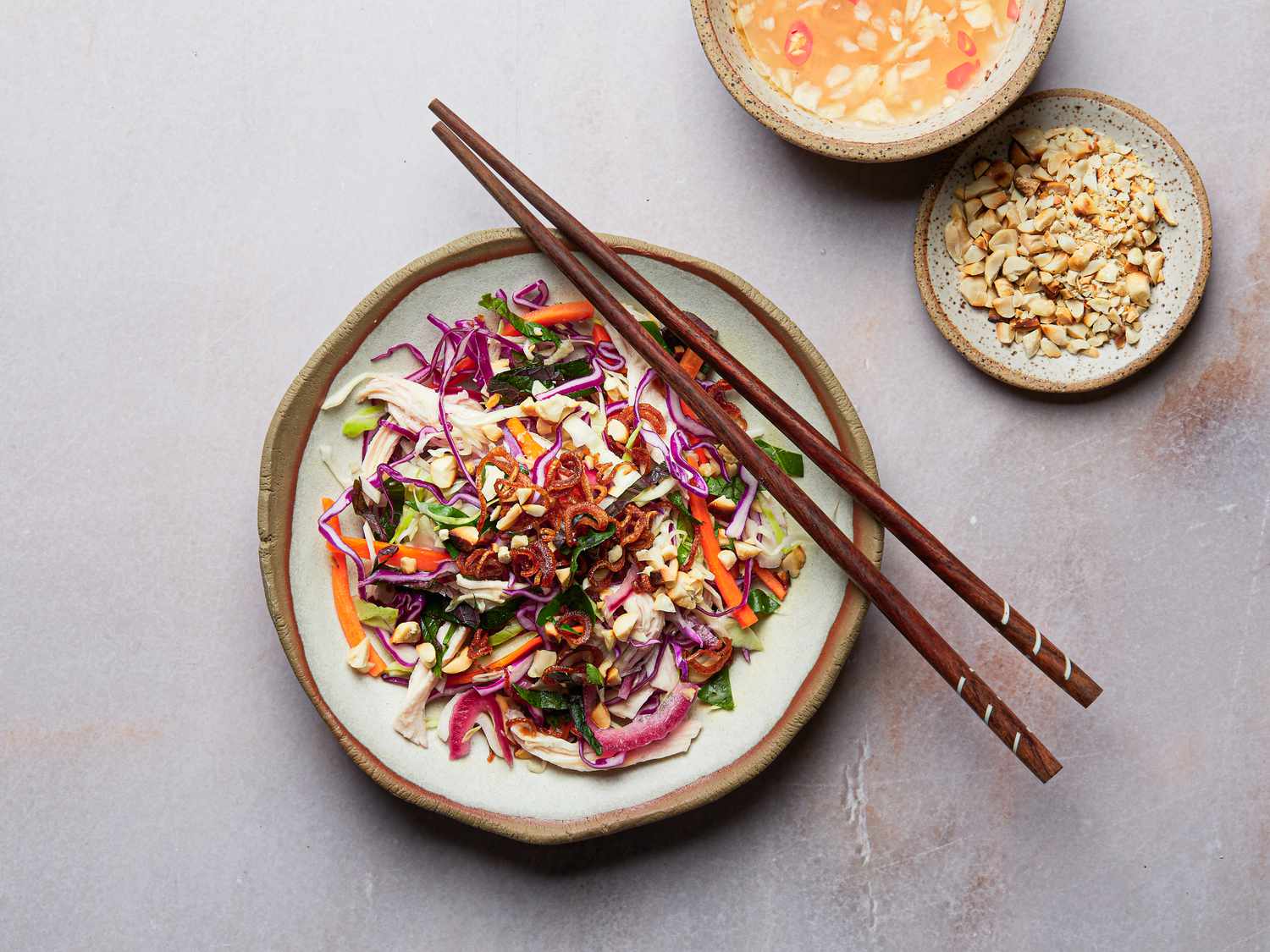 Overhead view of single serving of chicken and cabbage salad