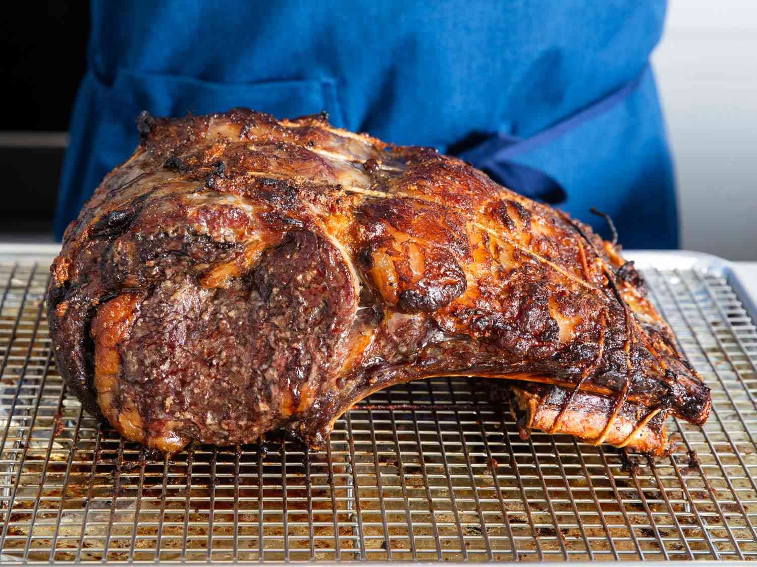 Roast koji prime rib on a wire rack-lined baking sheet.