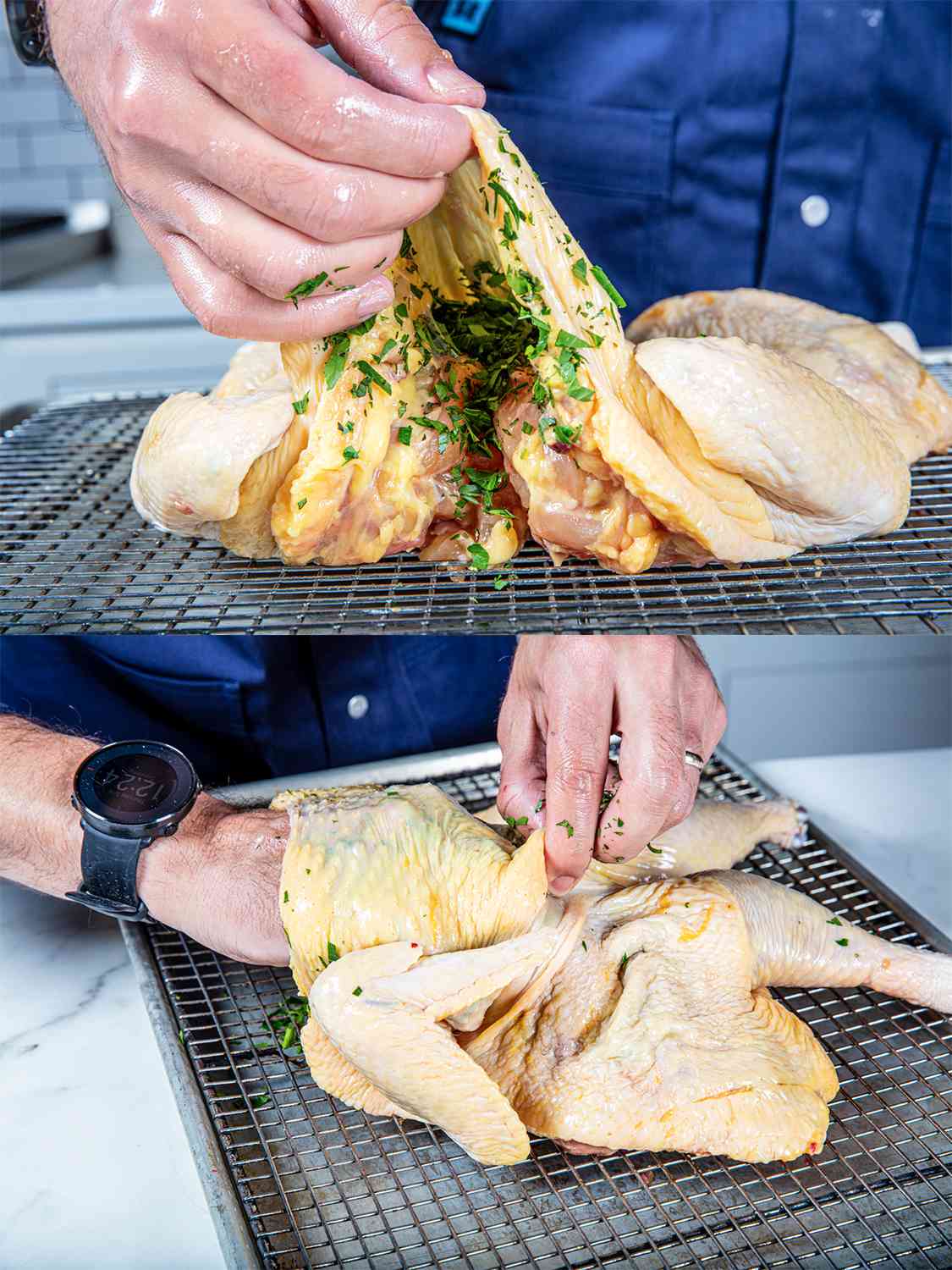 Placing herbs under the skin of a raw spatchcocked chicken before roasting.
