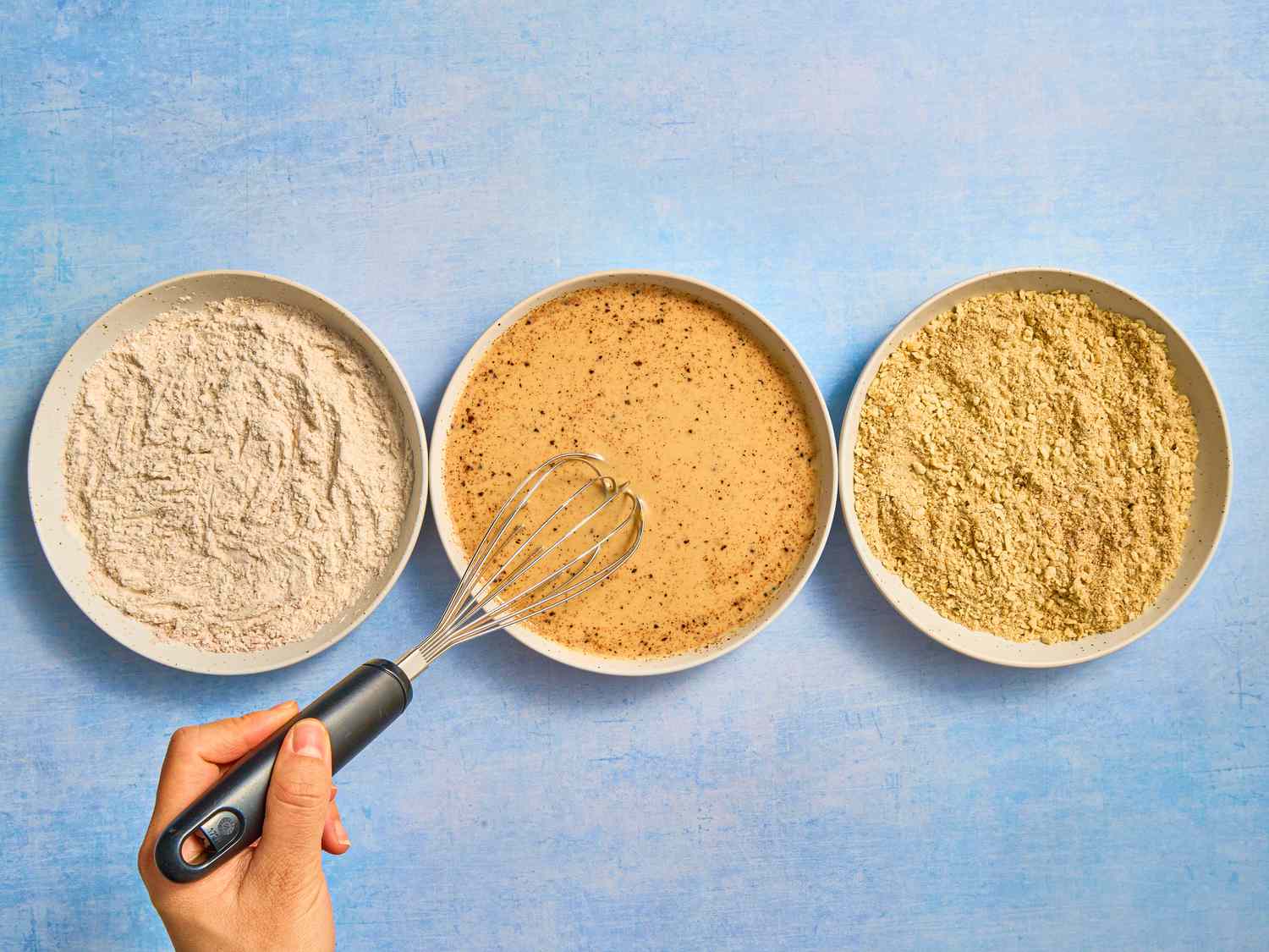 Overhead view of whisking spices with spices