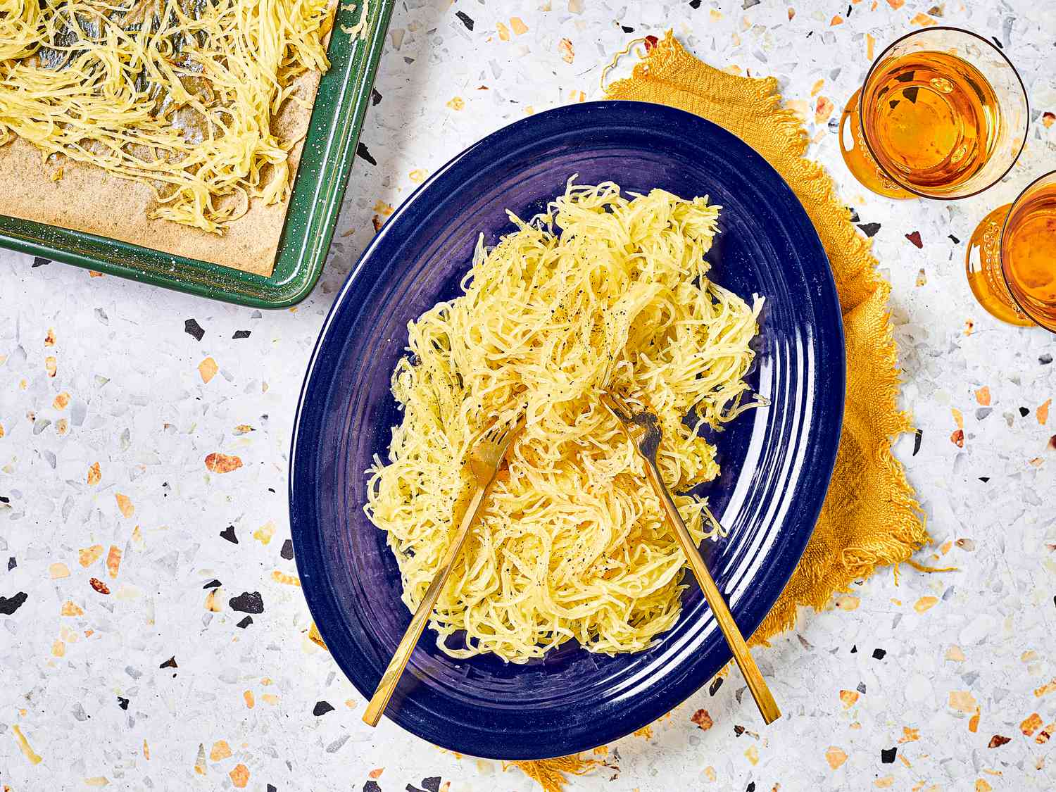 Overhead view of spaghetti squash on a blue plate