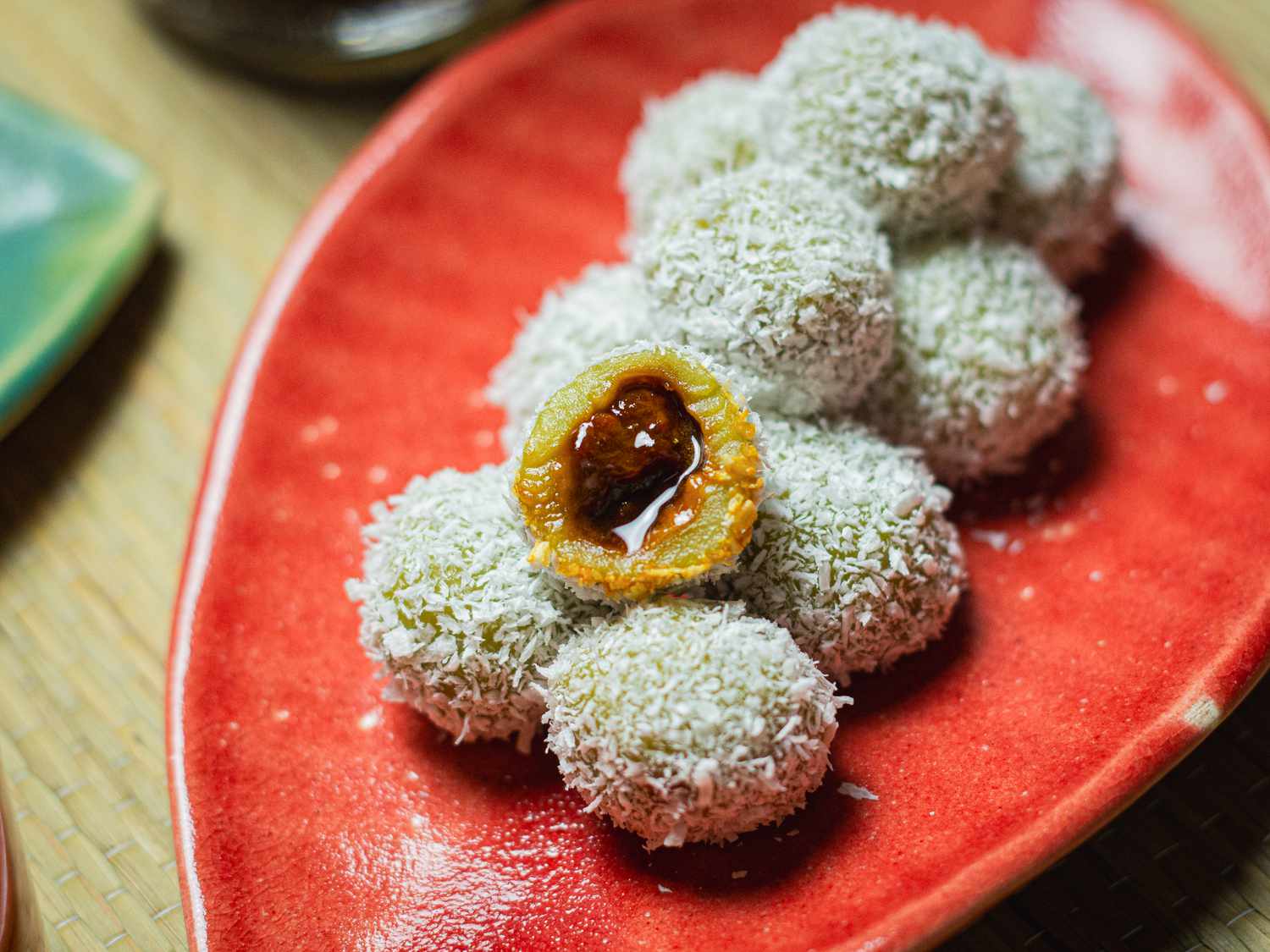 Side angle view of an onde-onde cut in half to show inside