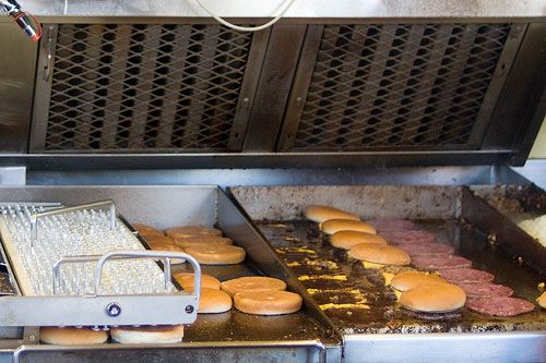 An image of the griddle station at an In-N-Out location.