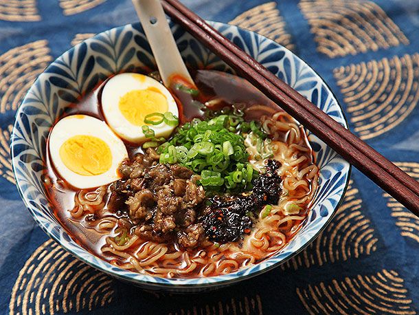 A bowl of ramen topped with smoked eggplant.