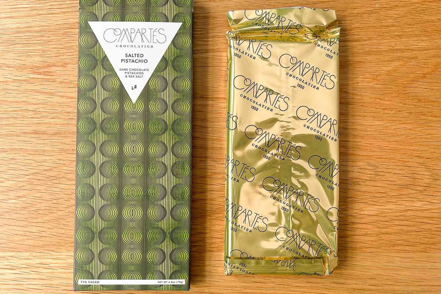 Compartés Salted Pistachio on a wood surface