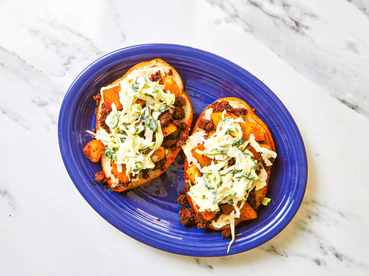 Overhead view of open pambazo sandwich